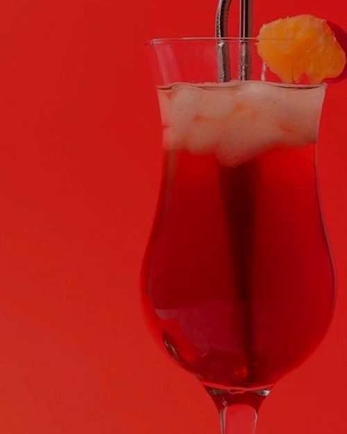 Iced strawberry tea in a hurricane glass